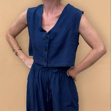 Load image into Gallery viewer, Person wearing a blue sleeveless top and wide-leg pants against a beige background