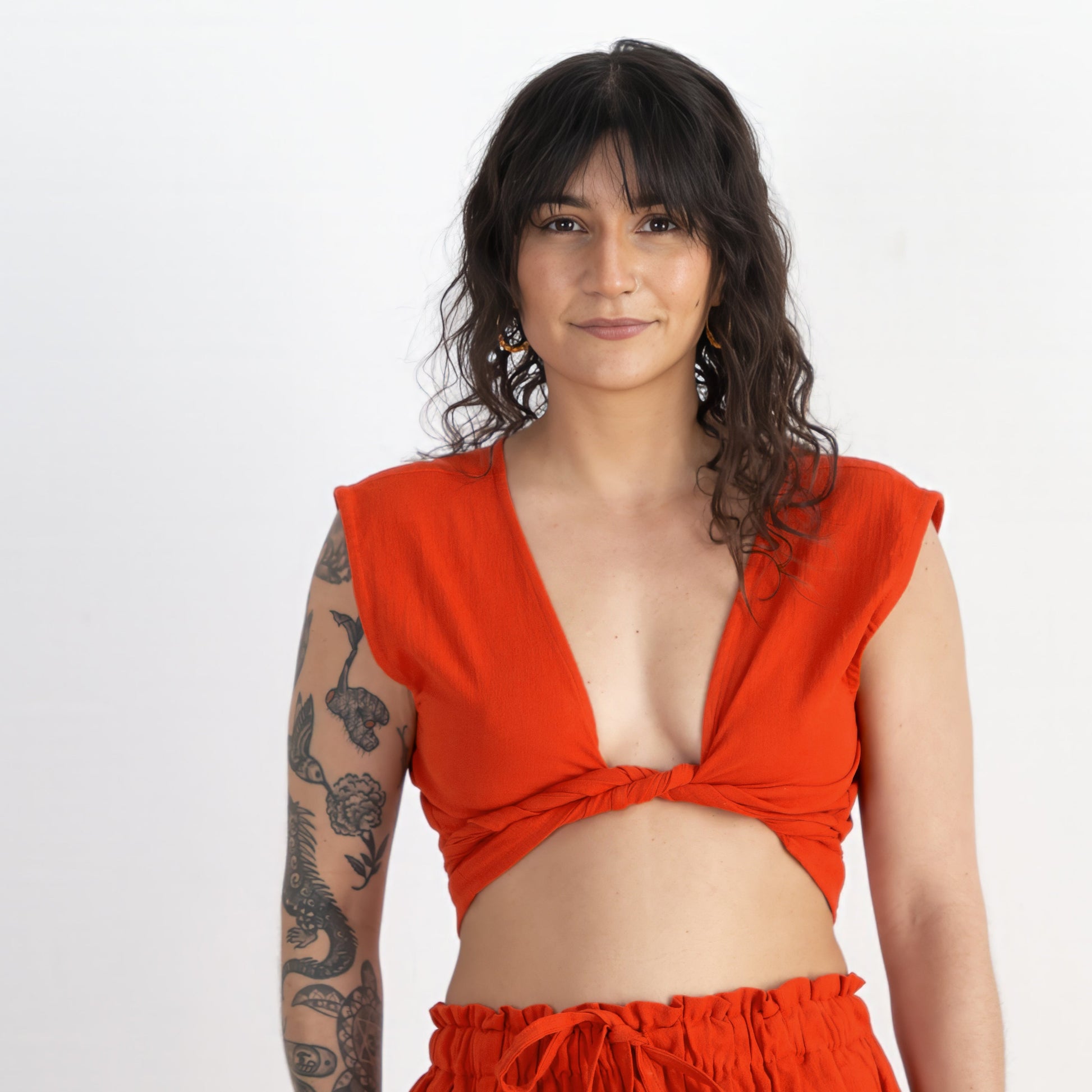 Woman wearing a bright red outfit on a white background