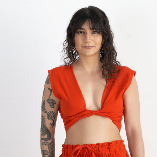 Woman wearing a bright red outfit on a white background