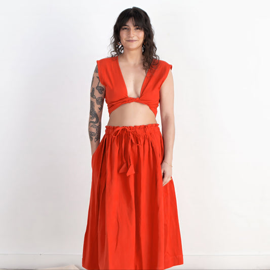 Woman wearing a red outfit on a white background